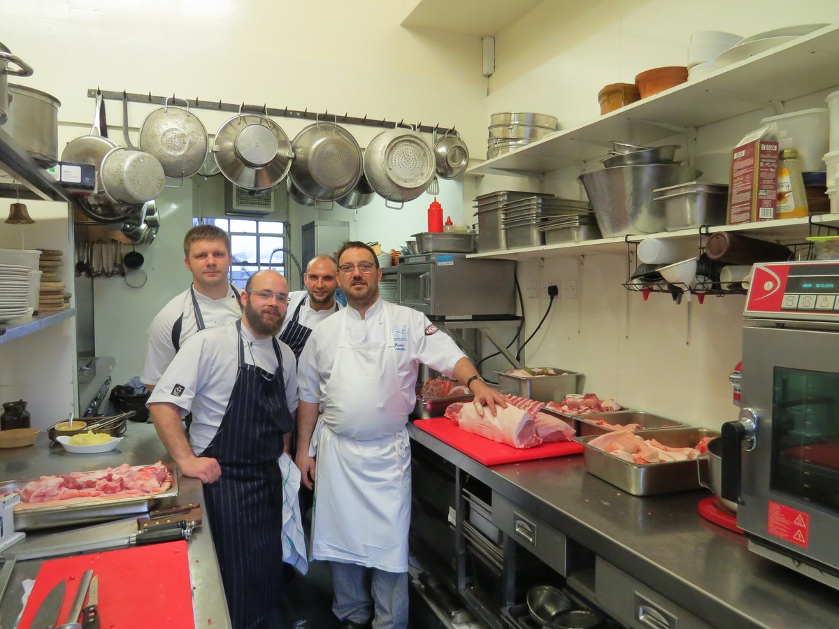 Fred Berkmiller (front row, right) with the kitchen brigade at L'Escargot Blanc.