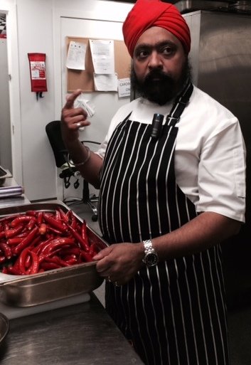 Tony preps the chillies for his hot sauce.