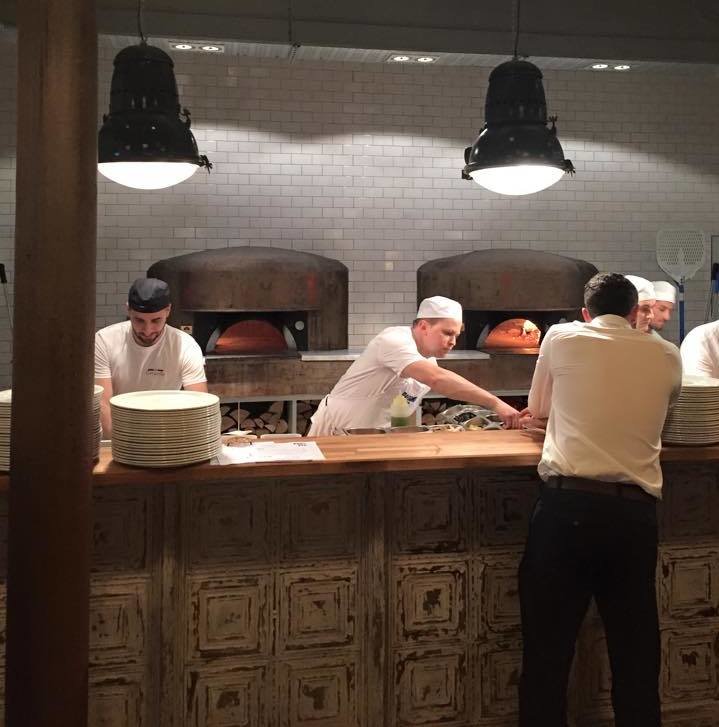 Wood-fired pizza ovens are helping fuel Paesano's popularity.