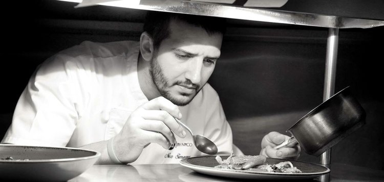 Nico Simeone plates up a dish in his restaurant.