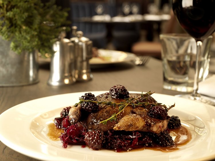 Borders grouse with red cabbage and brambles.