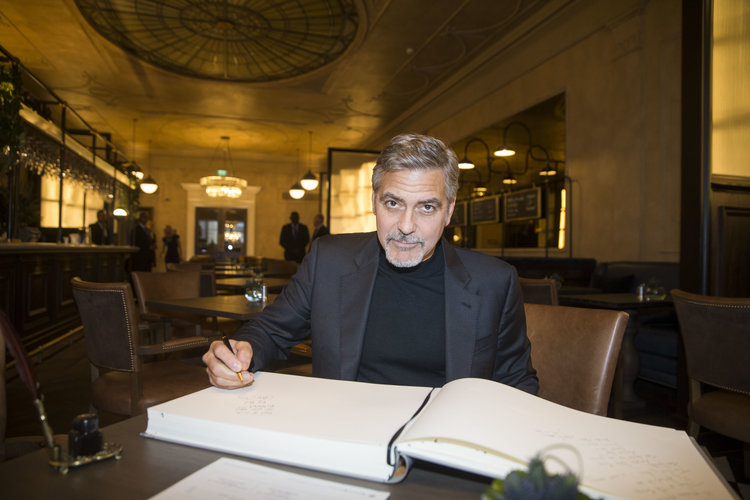 Actor George Clooney signs the guest book at The George Hotel. Pic: Stephen McCranor of Frame PR.