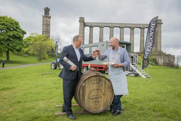 Neil Boyd, Commercial Director for Malts at Ian Macleod Distillers, and Chef Tom Lewis of Monachyle Mhor celebrate World Whisky Day with a Glengoyne on Calton Hill.