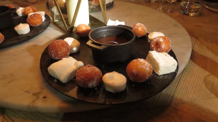Salted caramel fondue with doughnuts and marshmallows. 