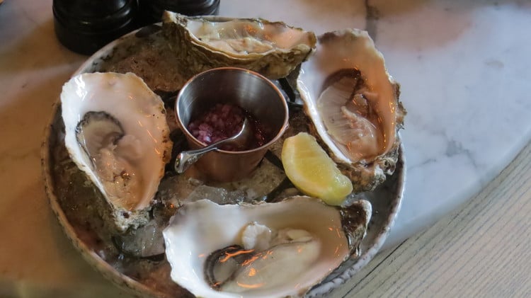Oysters with a classic shallot and red wine vinegar accompaniment.