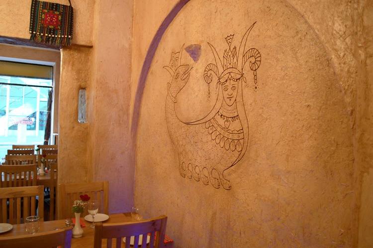 Traditional Kurdish art decorates the walls.