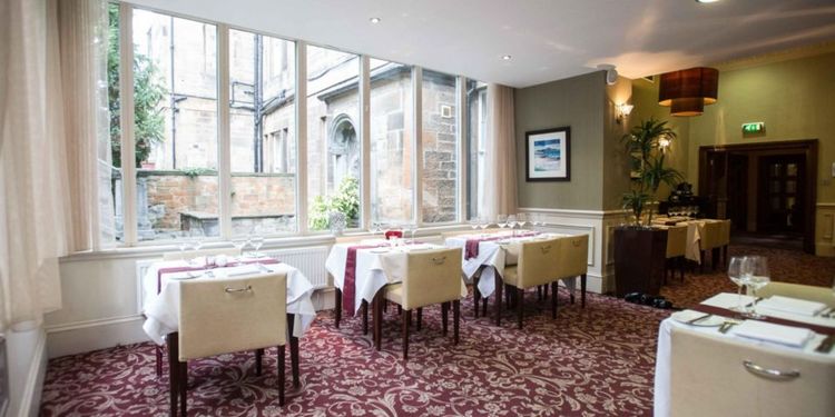 The dining room at Crowne Plaza Edinburgh leads into their private gardens.