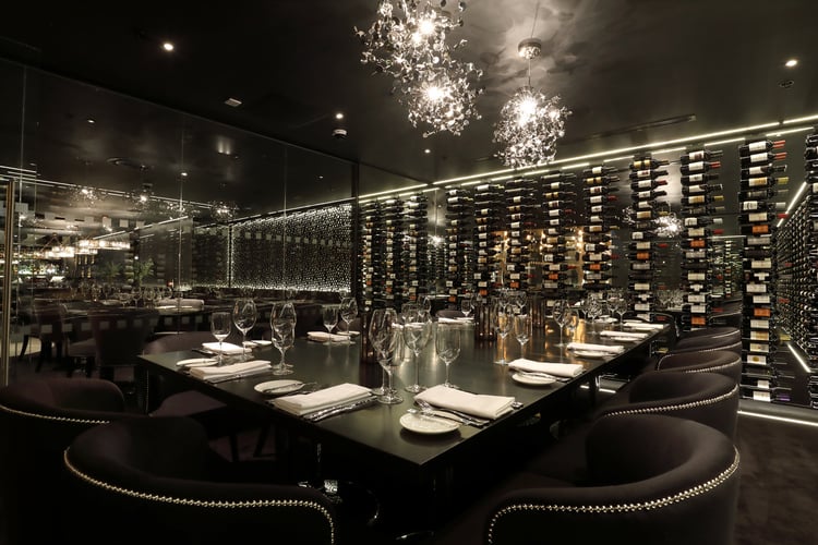 Private dining room with wine wall.